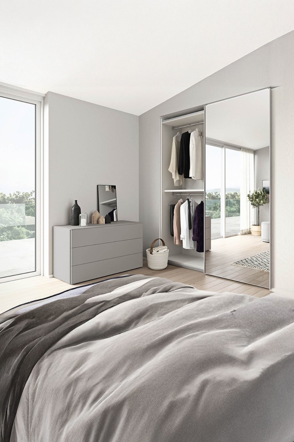 armoire-avec-porte-miroir-et-commode-avec-miroir-sur-pied-dans-une-chambre-confortablement-amenagee