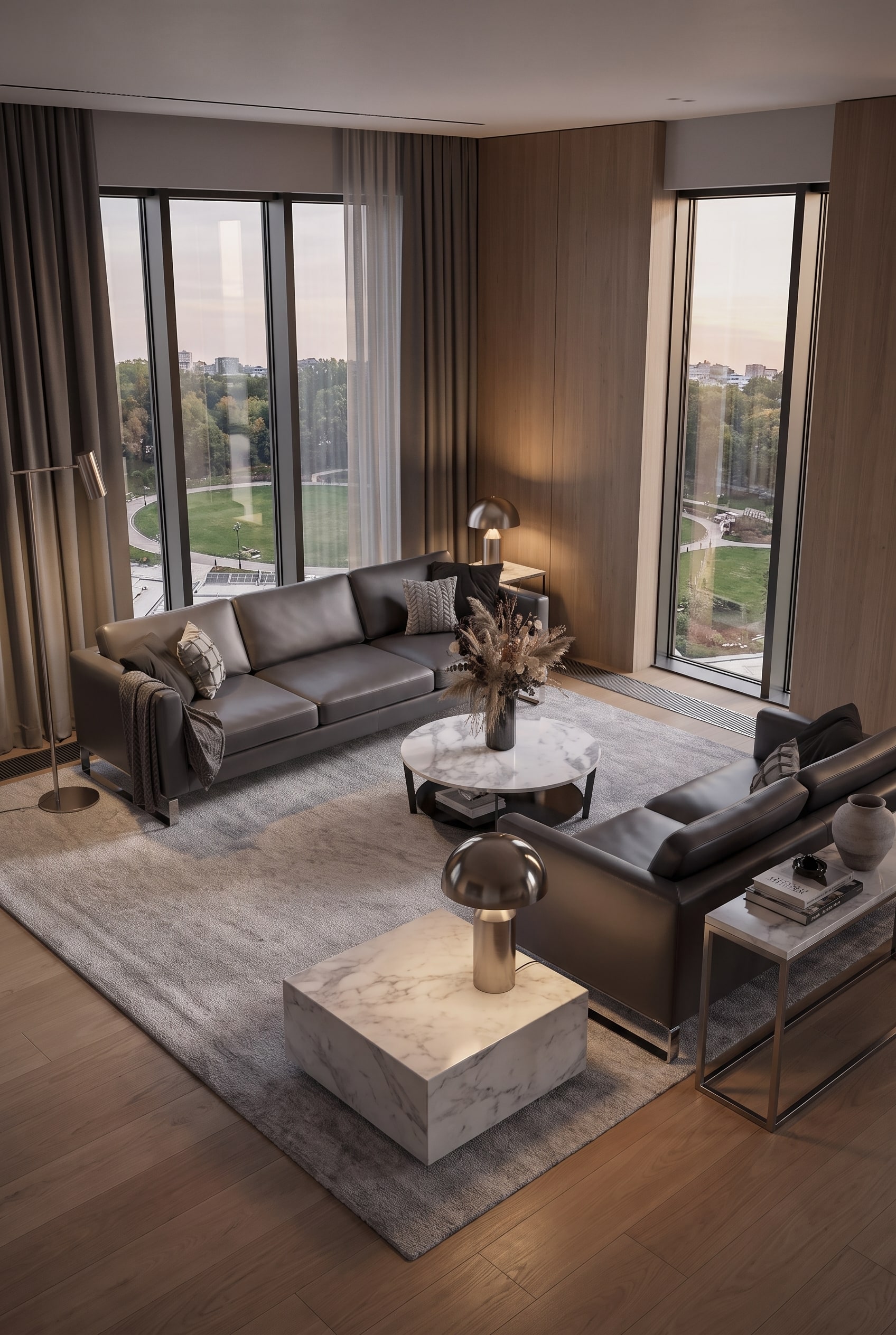 Hochwertiges graues Ledersofa in einem architektonisch klaren Wohnzimmer mit warmem Holzboden und dezentem Lichteinfall.
