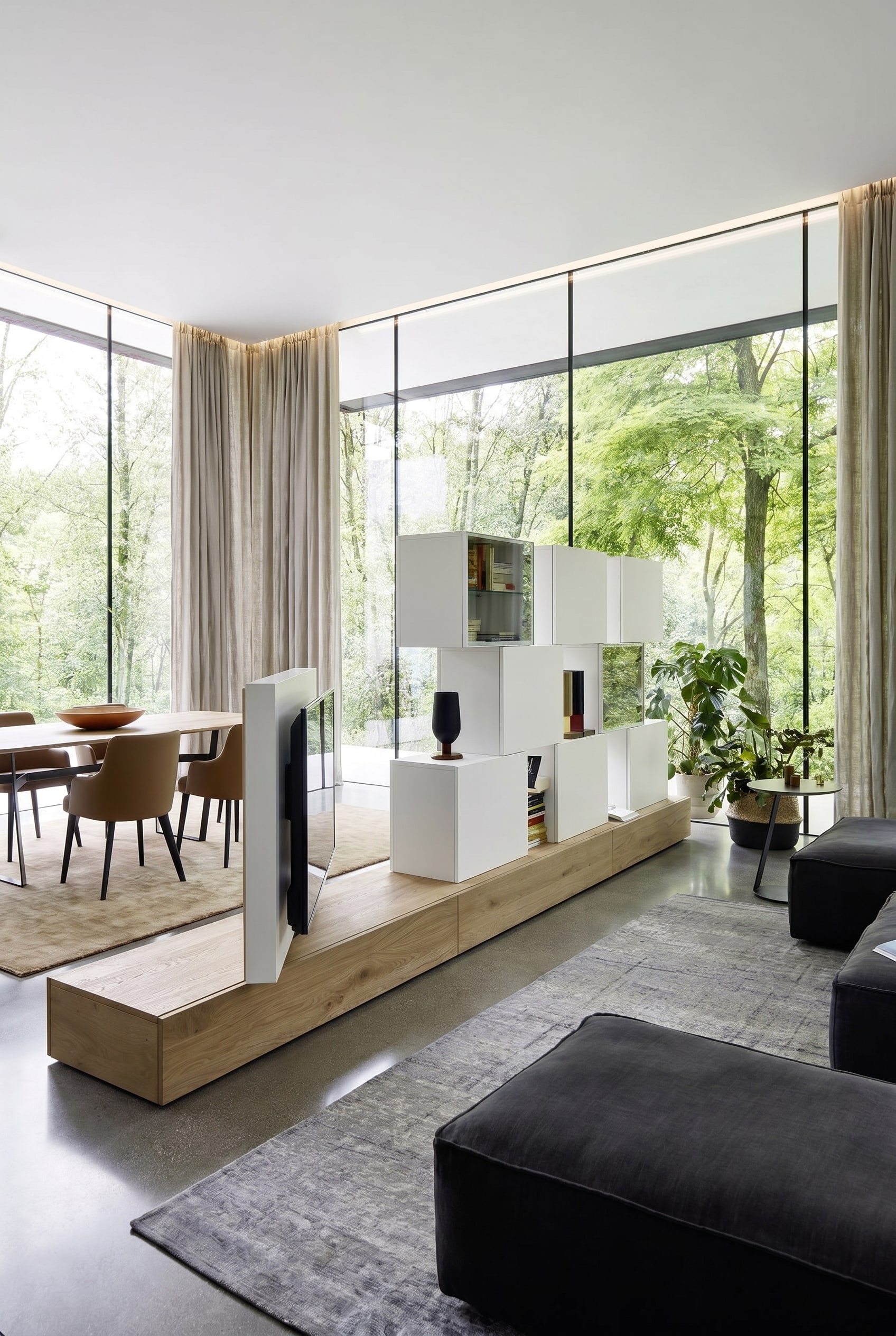 Doppelseitige Wohnwand, die als eleganter Raumteiler in einem offenen Grundriss fungiert Doppelseitige Wohnwand, die als eleganter Raumteiler in einem offenen Grundriss fungiert