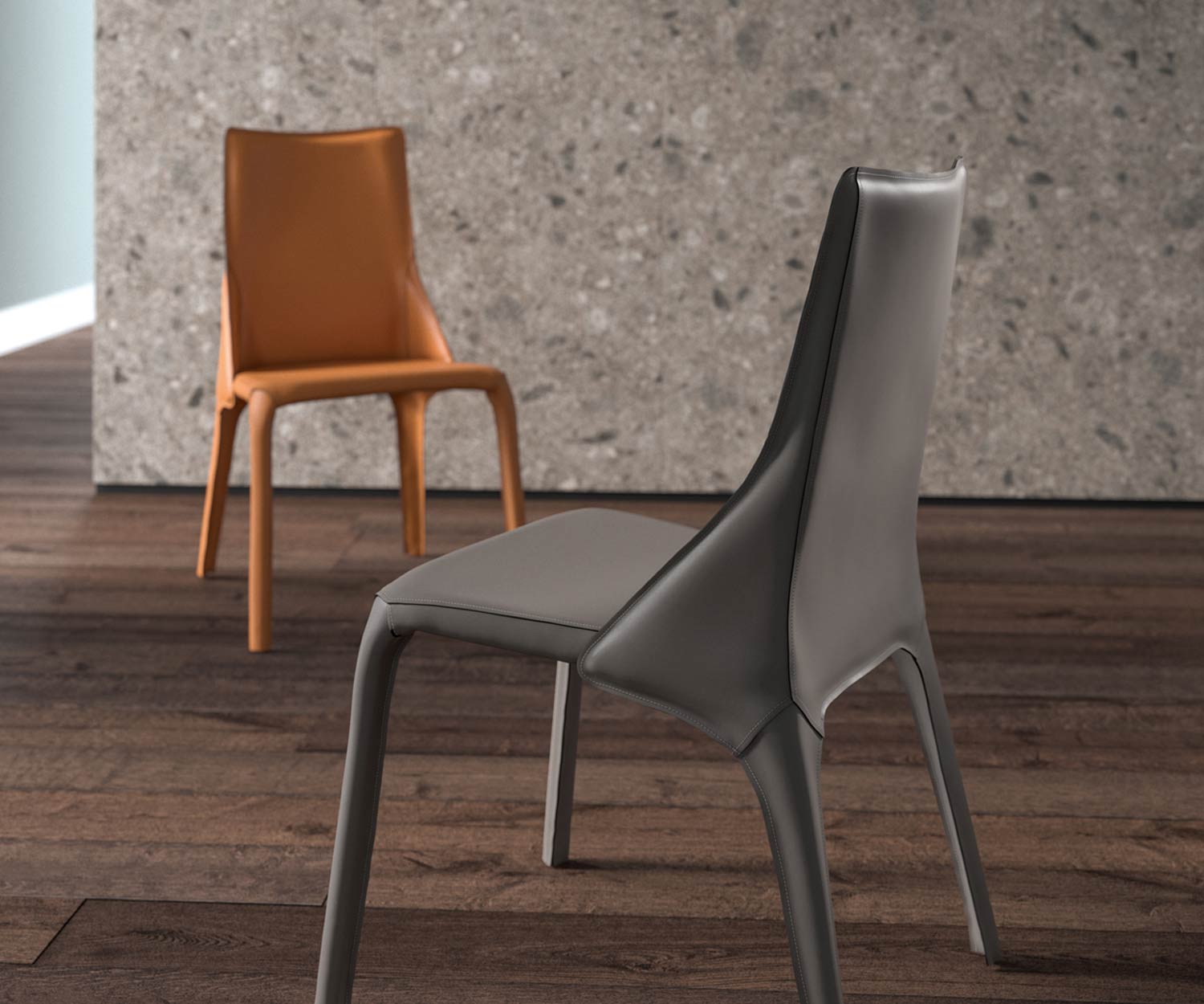 Chaise en cuir design deux chaises en cuir en détail dans les couleurs cognac et gris foncé