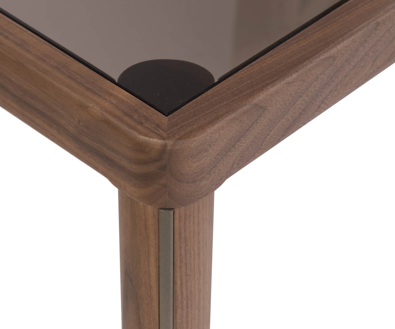Design exclusif table à manger détail coin avec plateau en verre et pied en noyer en vue