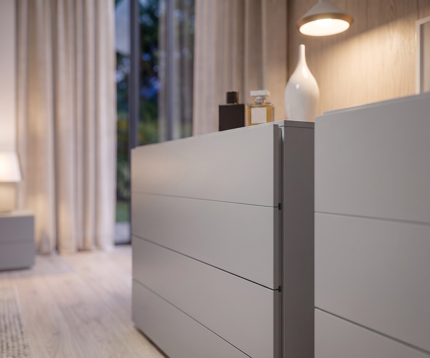 Commode 4 tiroirs Novamobili Easy Commode 4 tiroirs Easy de Novamobili dans une chambre: meuble de rangement gris clair sans poignées au style épuré.